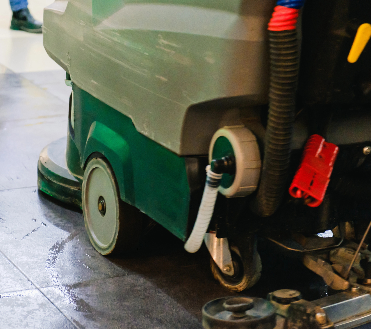 Industrial ride-on floor scrubber