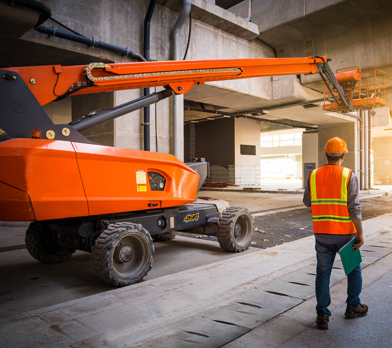 Industrial boom lift on a job site powered by VMAX deep-cycle batteries